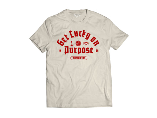 Flat lay of the cream and red get lucky on purpose t-shirt front glop