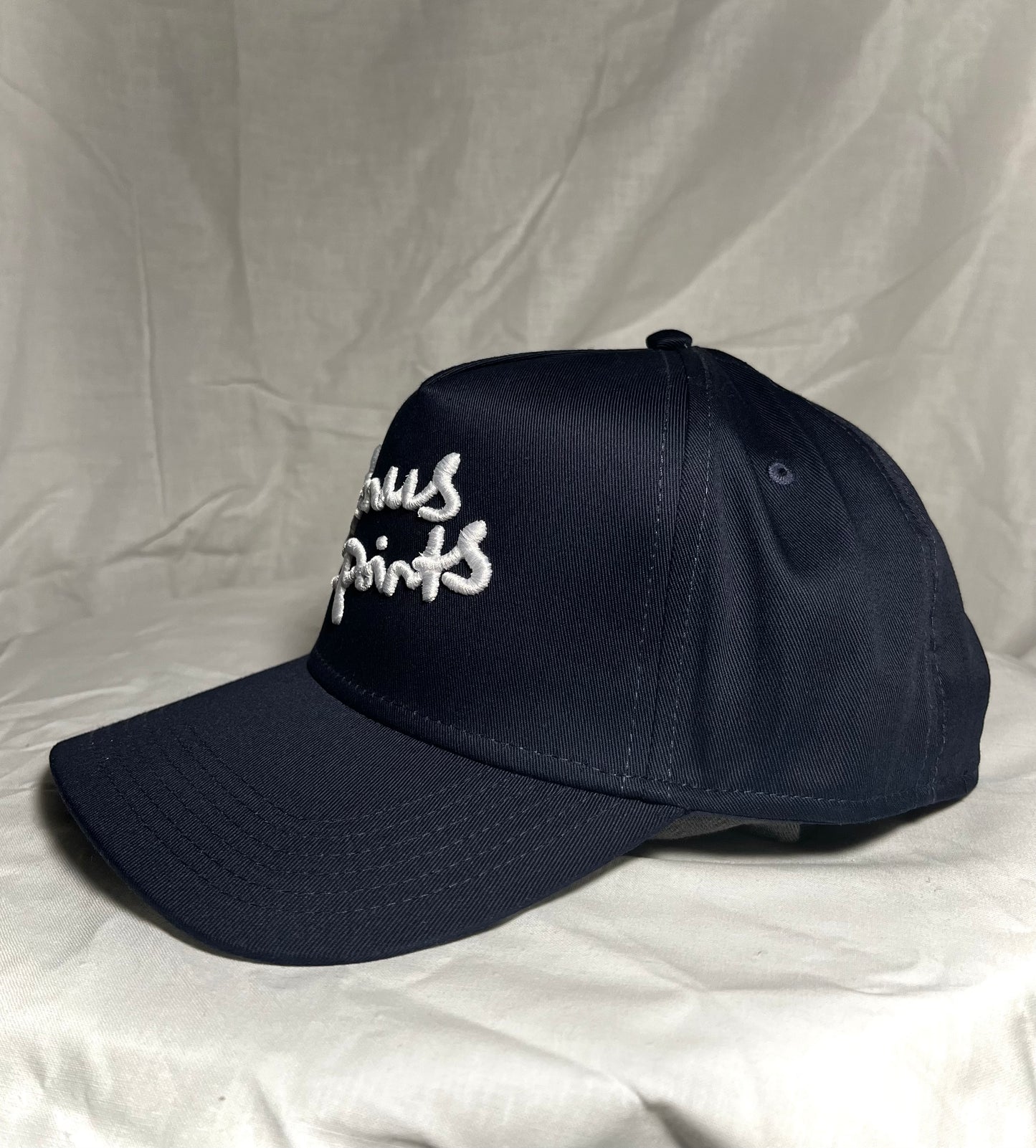 Side View Navy Blue SnapBack With White Extra Credit Logo puff embroidered across front panel